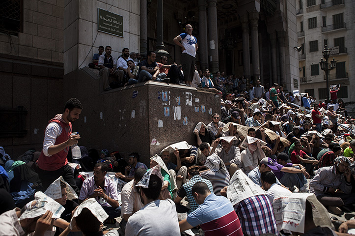 Midday prayers at the Al-Fateh Mosque in Ramses Square for as Tahrir Square