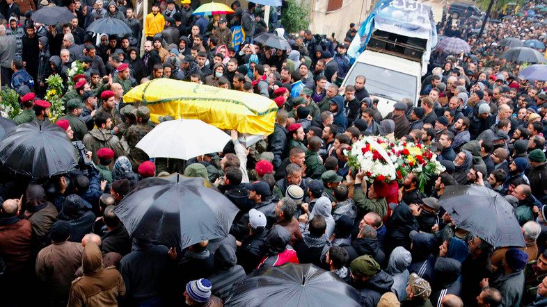Lebanon's Hezbollah members and relatives carry coffin of commander al-Laqqis during funeral in Baalbeck