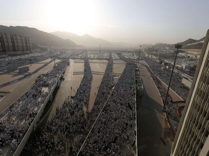 Muslim pilgrims arrive to cast stones at pillars symbolizing Satan, during the annual haj pilgrimage, on the first day of Eid al-Adha in Mina