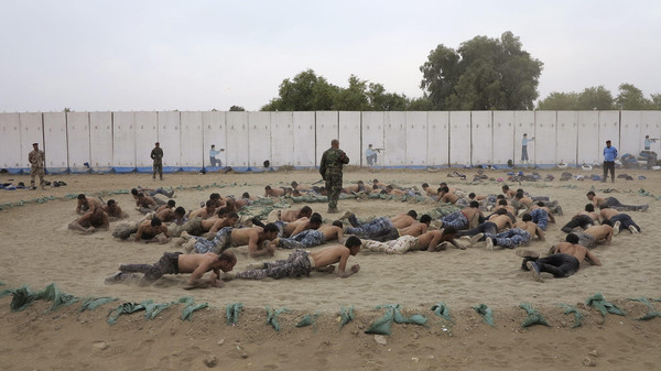 Tribal fighters take part in a military training to prepare for fighting against Islamic State militants, on the outskirts of Ramadi
