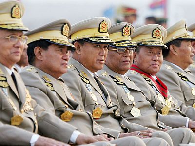 **FILE**Myanmar's military leaders look on Tuesday, March 27, 2007, as they wait for the arrival of Myanmar's military junta leader Gen. Than Shwe just prior to Armed Forces Day ceremonies in the new capital city of Naypyidaw, Myanmar. Daily demonstrations by tens of thousands of people have grown into the stiffest challenge to the ruling junta in two decades. (AP Photo/David Longstreath, FILE)