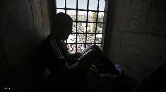 A Palestinian Muslim worshiper reads the Koran, Islam's holy book, in the Al-Aqsa Mosque compound in Jerusalem during the second  Friday prayer of the holy month of Ramadan, on June 26, 2015. AFP PHOTO/AHMAD GHARABLI        (Photo credit should read AHMAD GHARABLI/AFP/Getty Images)