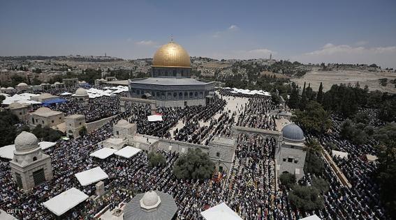 A picture taken from the minaret of a mosque shows Palestinian Muslim worshipers praying near the Dome of the Rock mosque in the Al-Aqsa Mosque compound in Jerusalem during the second Friday prayer of the holy month of Ramadan, on June 26, 2015. AFP PHOTO/AHMAD GHARABLI        (Photo credit should read AHMAD GHARABLI/AFP/Getty Images)