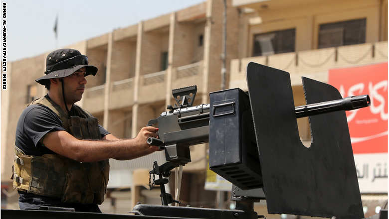 A member of Iraqi security forces monitor sa street from an armoured vehicle outside Shorja market in central Baghdad on June 16, 2015, as security measures have been reinforced ahead of the Muslim holy month of Ramadan due to start this week.   AFP PHOTO / AHMAD AL-RUBAYE        (Photo credit should read AHMAD AL-RUBAYE/AFP/Getty Images)