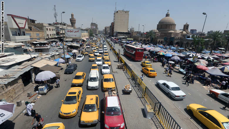 A picture taken on June 16, 2015 shows cars driving past stalls at Shorja market in central Baghdad, as Iraqis prepare for the holy month of Ramadan due to start this week.   AFP PHOTO / AHMAD AL-RUBAYE        (Photo credit should read AHMAD AL-RUBAYE/AFP/Getty Images)