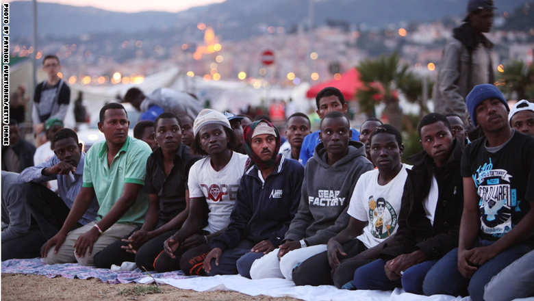 VENTIMIGLIA, ITALY - JUNE 17: Migrants pray for the start of ramadan as they gather at the French border hoping to enter the country on June 17, 2015 in Ventimiglia, Italy. A group of around 200 migrants, mostly from Libya, Sudan and Eritrea, were left stranded at the border after French police refused them entry to the country. (Photo by Patrick Aventurier/Getty Images)