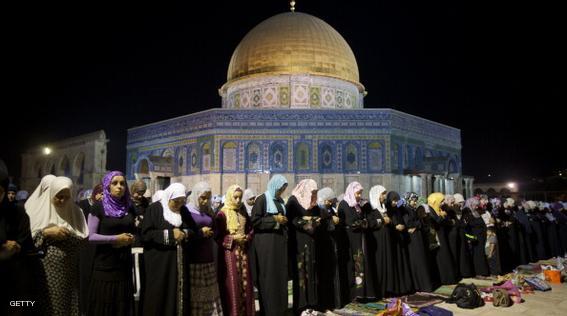 Palestinian Muslim women perform the "Tarawih" evening prayer in front of the Dome of the Rock at the Al-Aqsa mosque compound in the old city of Jerusalem during the fasting month of Ramadan on July 31, 2012. AFP PHOTO / AHMAD GHARABLI        (Photo credit should read AHMAD GHARABLI/AFP/Getty Images)