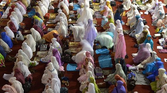 Indonesian Muslim women offer prayers during the month of Ramadan at the Istiqlal mosque in Jakarta on June 21, 2015.  More than 1.5 billion Muslims around the world celebrate the month with fast from dawn to dusk and conduct night prayers.    AFP PHOTO / ADEK BERRY        (Photo credit should read ADEK BERRY/AFP/Getty Images)