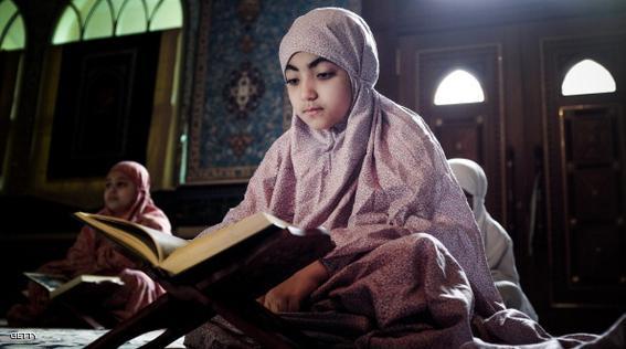 Young Bahraini Shiite Muslim girls read the Koran, Islam's holy book, during the holy fasting month of Ramadan at a mosque in the village of Sanabis, west of Manama, on July 27, 2013. AFP PHOTO/MOHAMMED AL-SHAIKH        (Photo credit should read MOHAMMED AL-SHAIKH/AFP/Getty Images)