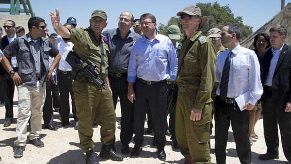 U.S. Secretary of Defense Ash Carter (front 3rd L), Israel's Defence Minister Moshe Ya'alon (front 2nd L), Israeli Brigadier General Moni Katz (front L) and Deputy Chief of Staff Major General Yair Golan stand at the Hussein Lookout near Kiryat Shmona, Israel's border with Lebanon, July 20, 2015. Carter, making the first visit by a U.S. cabinet official to Israel since last week's landmark agreement to curb Iran's nuclear program, aims to move away from political tensions over the accord to more cool-headed, nuts-and-bolts discussions on deepening security ties. REUTERS/Carolyn Kaster/Pool