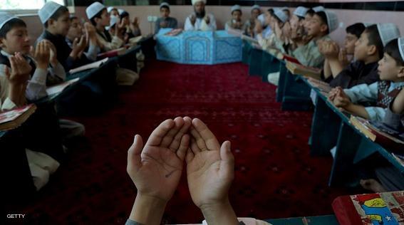 Afghan children pray after studying the Quran during the holy month of Ramadan at a mosque in Ghazni province on 27, 2015.   Across the Muslim world, the faithful fast from dawn to dusk and strive to be more pious during the holy month, which ends with the Eid holiday.  AFP PHOTO / Rahmatullah Alizadah        (Photo credit should read Rahmatullah Alizadah/AFP/Getty Images)