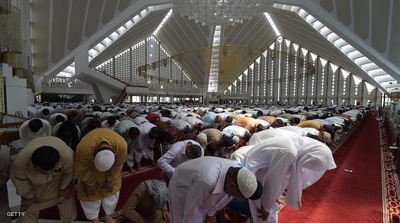 Pakistani Muslims offer first Friday prayers during the Muslim fasting month of Ramadan at The Grand Faisal Mosque in Islamabad on June 19, 2015. Islam's holy month of Ramadan is celebrated by Muslims worldwide marked by fasting, abstaining from foods, sex and smoking from dawn to dusk for soul cleansing and strengthening the spiritual bond between them and the Almighty. AFP PHOTO / AAMIR QURESHI        (Photo credit should read AAMIR QURESHI/AFP/Getty Images)