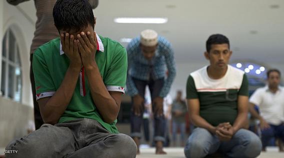TO GO WITH AFP STORY BY NATALIA RAMOS Muslims pray at Do Pari mosque in downtown Sao Paulo, Brazil on March 4, 2015. The Pari mosque hosts a muslim charity association  which organizes Portuguese language courses for refugees and helps them get their Brazilian papers.  AFP PHOTO / NELSON ALMEIDA        (Photo credit should read NELSON ALMEIDA/AFP/Getty Images)