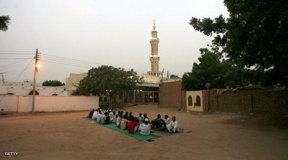 Sudanese break their fast  as they sit along a street in West Jarif, some 7 kilometers east of the capital Khartoum, on July 22, 2012.  Muslims fasting in the month of Ramadan must abstain from food, drink and sex from dawn until sunset, when they break the fast with the meal known as Iftar. AFP PHOTO / ASHRAF SHAZLY        (Photo credit should read ASHRAF SHAZLY/AFP/GettyImages)