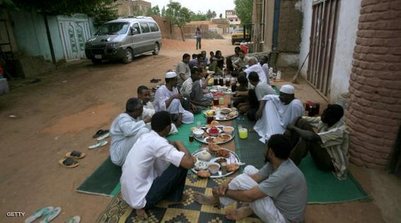Sudanese break their fast  as they sit along a street in West Jarif, some 7 kilometers east of the capital Khartoum, on July 22, 2012.  Muslims fasting in the month of Ramadan must abstain from food, drink and sex from dawn until sunset, when they break the fast with the meal known as Iftar. AFP PHOTO / ASHRAF SHAZLY        (Photo credit should read ASHRAF SHAZLY/AFP/GettyImages)