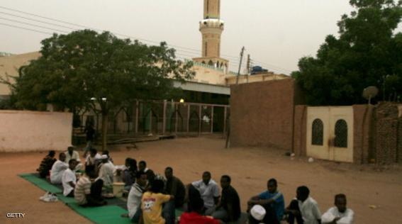 Sudanese break their Ramadan fast as they sit along a street in West Jarif, some 7 kilometers east of the capital Khartoum, on July 22, 2012.  Muslims fasting in the month of Ramadan must abstain from food, drink and sex from dawn until sunset, when they break the fast with the meal known as Iftar. AFP PHOTO / ASHRAF SHAZLY        (Photo credit should read ASHRAF SHAZLY/AFP/GettyImages)
