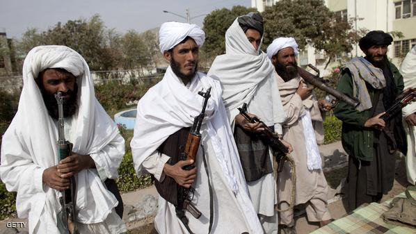 HERAT, AFGHANISTAN - NOVEMBER 4:  Surrendering Taliban militants stand with their weapons as they are presented to the media on November 4, 2010 in Herat, Afghanistan. Twenty Taliban fighters from Afghanistan's Herat province have surrendered to government troops in Herat, west of the capital city of Kabul. After an amnesty launched by President Hamid Karzai in November 2004, hundreds of anti-government Taliban militants have since surrendered to the government. (Photo by Majid Saeedi/Getty Images)