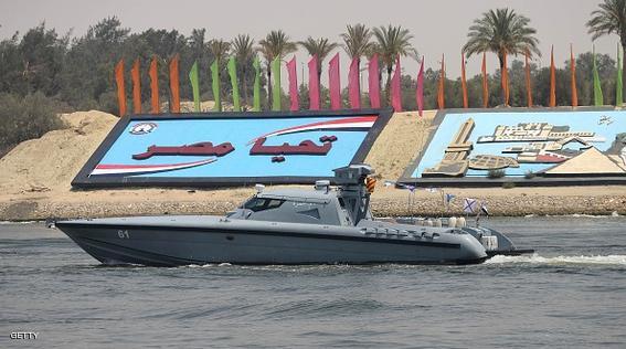 ISMAILIA, EGYPT - AUGUST 4:  An Egyptian military boat crossing the new waterway as they patrol around at the new Suez Canal in the Egyptian port city of Ismailia, east of Cairo on August 4, 2015. Preparations continue  ahead of the formal inauguration of the new shipping route on August 6. (Photo by Stringer                            /Anadolu Agency/Getty Images)