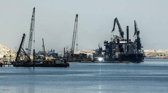 A picture taken on July 29, 2015 shows ships and boats at the new Suez Canal in the Egyptian port city of Ismailia, east of Cairo. Egypt began the first trial run of its "new Suez canal," officials and state media said, ahead of the formal inauguration of the new shipping route on August 6. Dubbed the Suez Canal Axis, the new 72-kilometre (45 mile) project is aimed at speeding up traffic along the existing waterway by reducing the waiting period of vessels, as well as boosting revenues for Egypt. AFP PHOTO / KHALED DESOUKI        (Photo credit should read KHALED DESOUKI/AFP/Getty Images)