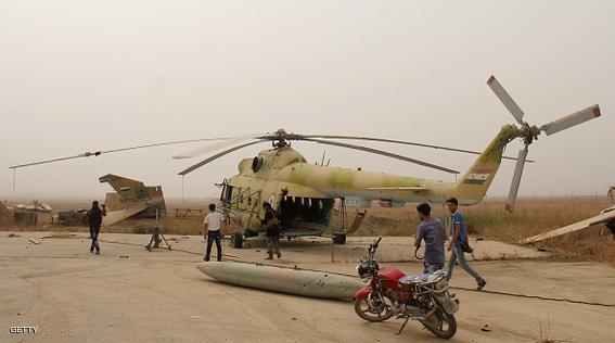 Journalists take photos of members of Al-Qaeda's Syrian affiliate and its allies after they seized the Abu Duhur military airport, the last regime-held military base in northwestern Idlib province on September 9, 2015 in the latest setback for President Bashar al-Assad's forces. Al-Nusra Front and a coalition of mostly Islamist groups captured the military airport after a siege that lasted two years, the Syrian Observatory for Human Rights monitor said. AFP PHOTO / OMAR HAJ KADOUR        (Photo credit should read OMAR HAJ KADOUR/AFP/Getty Images)