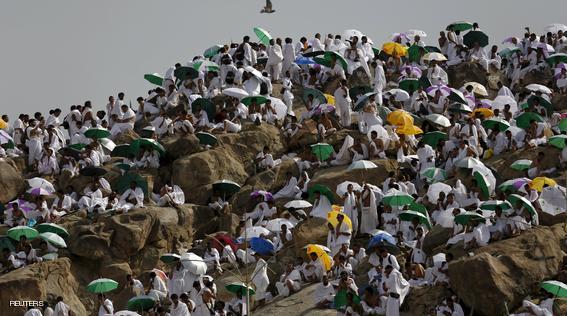 Muslim pilgrims pray on Mount Mercy on the plains of Arafat during the annual haj pilgrimage, outside the holy city of Mecca September 23, 2015. REUTERS/Ahmad Masood