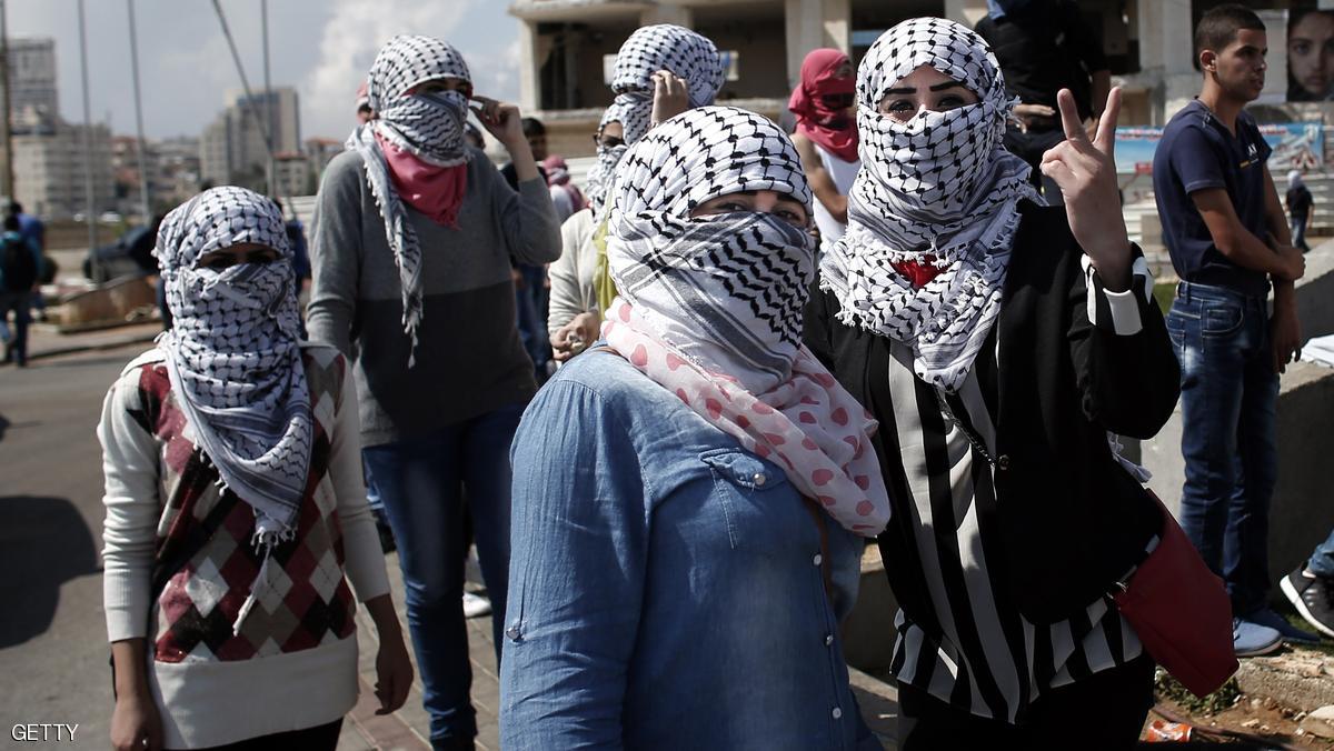 Palestinian female demonstraters pose for the camera ahead of clashes with Israeli security forces in Beit El, near the West Bank city of Ramallah, on October 8, 2015. There have been at least eight stabbing attacks since the beginning of the month, when a Palestinian killed two Israelis in Jerusalem's Old City, helping to prompt a security crackdown and spread riots. AFP PHOTO / THOMAS COEX (Photo credit should read THOMAS COEX/AFP/Getty Images)