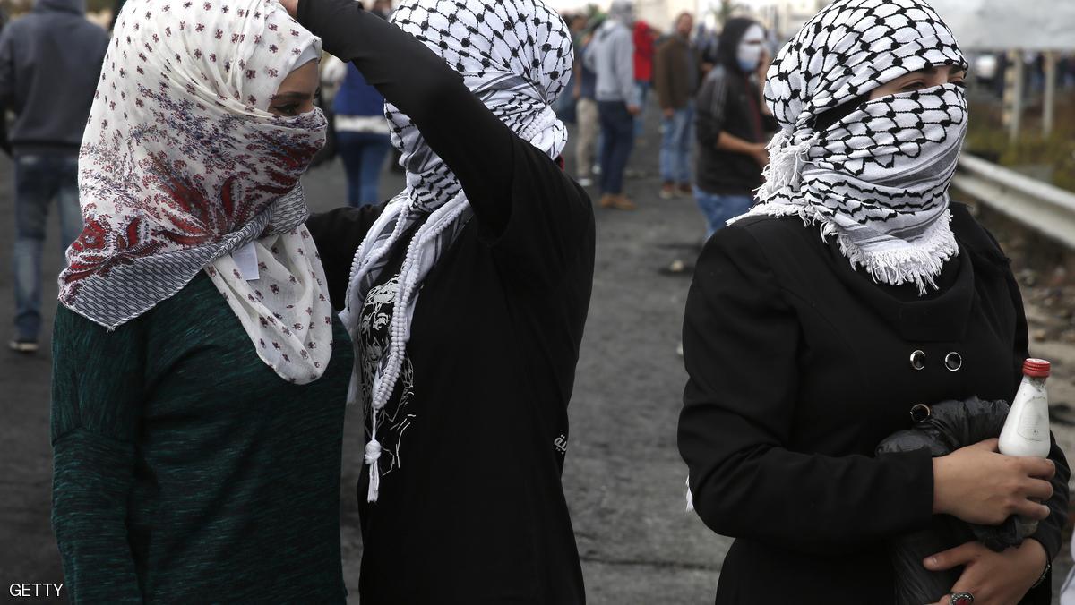 Palestinian young women from the Birzeit University take part in clashes with Israeli security forces in Beit El, on the outskirts of the West Bank city of Ramallah, on October 7, 2015. New violence rocked Israel and the Israeli-occupied West Bank, including a stabbing in annexed east Jerusalem, even as Israel and Palestinian president Mahmud Abbas took steps to ease tensions. AFP PHOTO / ABBAS MOMANI (Photo credit should read ABBAS MOMANI/AFP/Getty Images)
