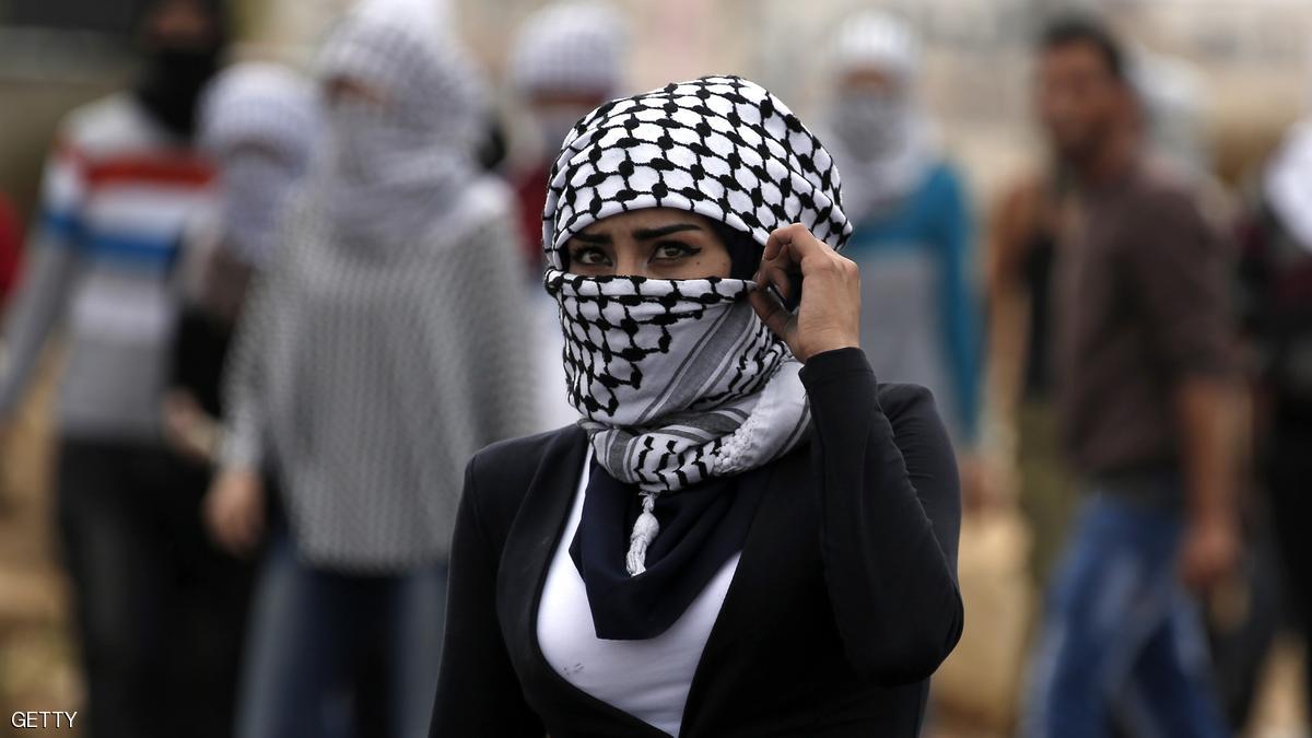 A Palestinian young woman from the Birzeit University looks on during clashes with Israeli security forces in Beit El, on the outskirts of the West Bank city of Ramallah, on October 7, 2015. New violence rocked Israel and the Israeli-occupied West Bank, including a stabbing in annexed east Jerusalem, even as Israel and Palestinian president Mahmud Abbas took steps to ease tensions. AFP PHOTO / ABBAS MOMANI (Photo credit should read ABBAS MOMANI/AFP/Getty Images)