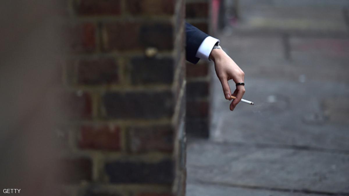 A man smokes a cigarette in central London on December 16, 2015. Imperial Tobacco Group on yesterday said it was dropping part of its name, the tobacco bit, ahead of a government clampdown on cigarette branding. AFP PHOTO / LEON NEAL / AFP / LEON NEAL (Photo credit should read LEON NEAL/AFP/Getty Images)