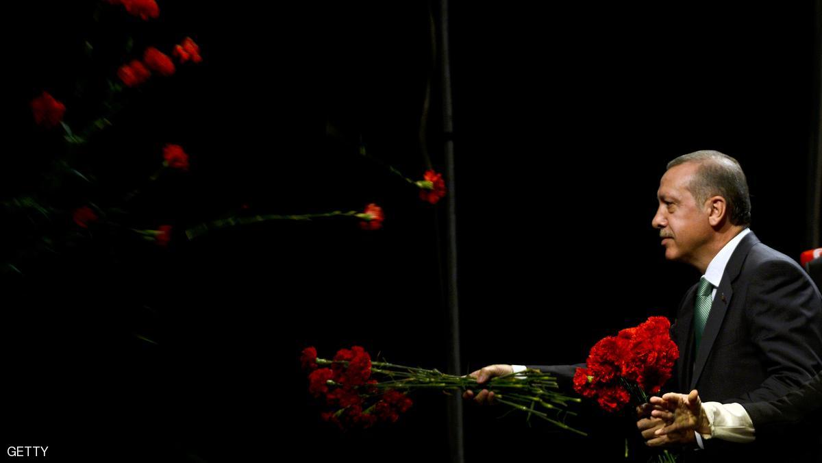 COLOGNE, GERMANY - MAY 24: Turkish Prime Minister Recep Tayyip Erdogan throws roses to Turkish expatriates at an event to mark the 10th anniversary of the UETD, the Union of European Turkish Democrats, at the Lanxess Arena on May 24, 2014 in Cologne, Germany. Erdogan faces Turkish presidential elections in August and his critics have lambasted him for his handling of the recent mine catastrophe at Soma. (Photo by Sascha Schuermann/Getty Images)
