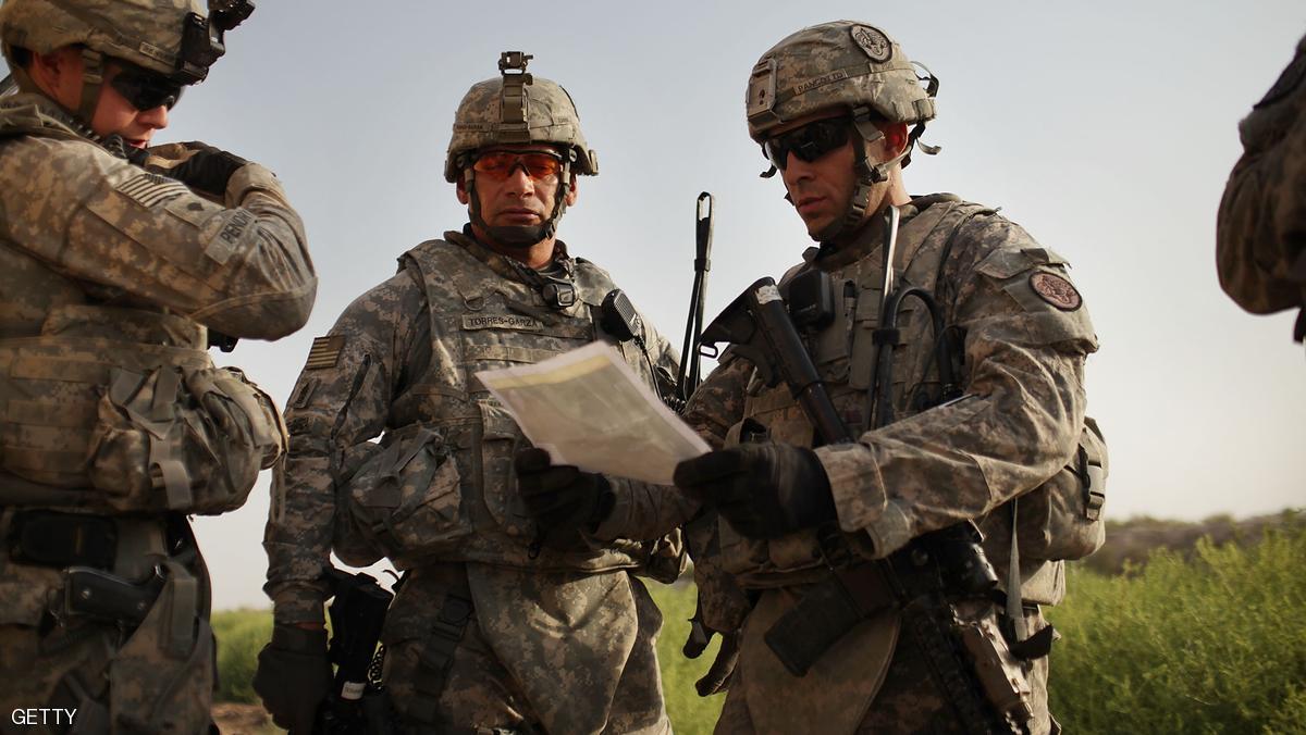 ISKANDARIYA, IRAQ - JULY 17:  U.S. soldiers with the 3rd Armored Cavalry Regiment look at a map while on a patrol on July 17, 2011 in Iskandariya, Babil Province Iraq. As the deadline for the departure of the remaining American forces in Iraq approaches, Iraqi politicians have agreed to meet in two weeks time in order to give a final decision about extending the U.S. troops' presence beyond the end of the 2011 deadline. Violence against foreign troops has recently picked-up with June being the worst month in combat-related deaths for the military in Iraq in more than two years. Currently about 46,000 U.S. soldiers remain in Iraq.  (Photo by Spencer Platt/Getty Images)