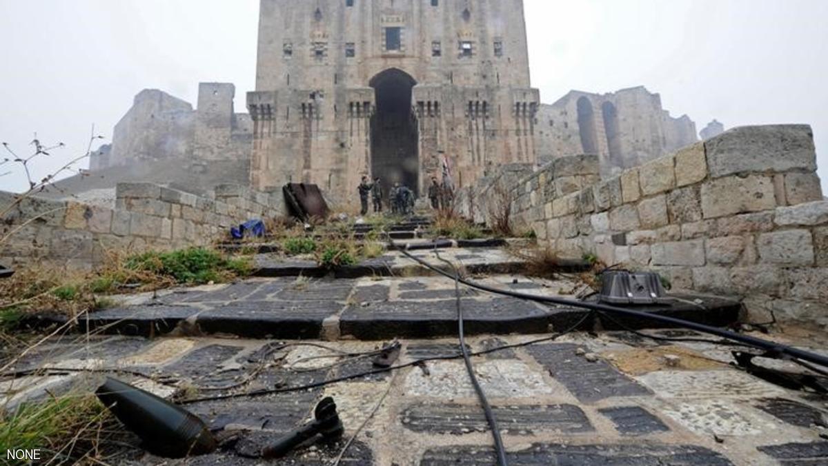 The remains of a shell are seen as forces loyal to Syria's President Bashar al-Assad stand inside Aleppo's historic citadel, during a media tour, Syria December 13, 2016. REUTERS/Omar Sanadiki