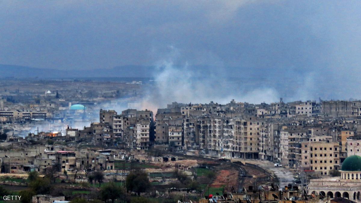 A general view shows smoke rising from buildings in Aleppo's southeastern al-Zabdiya neighbourhood following government strikes on December 14, 2016. Shelling and air strikes sent terrified residents running through the streets of Aleppo as a deal to evacuate rebel districts of the city was in danger of falling apart. / AFP / STRINGER (Photo credit should read STRINGER/AFP/Getty Images)